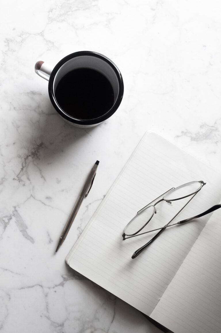 A single lamp over a working desk