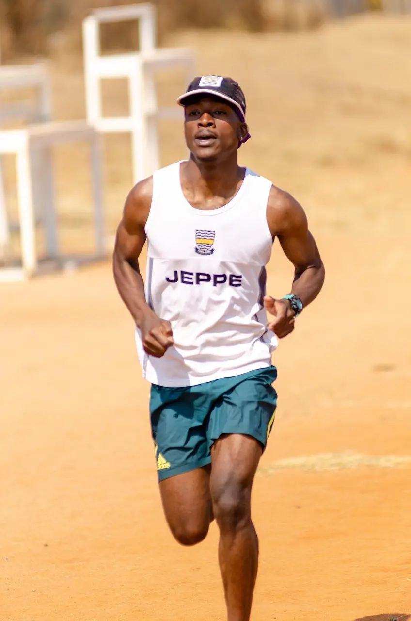 Man running with visible effort, symbolizing stress inoculation through controlled challenge