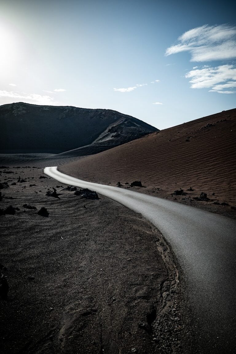 A straight road under open sky