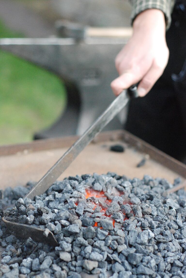 A smith shaping iron by hand