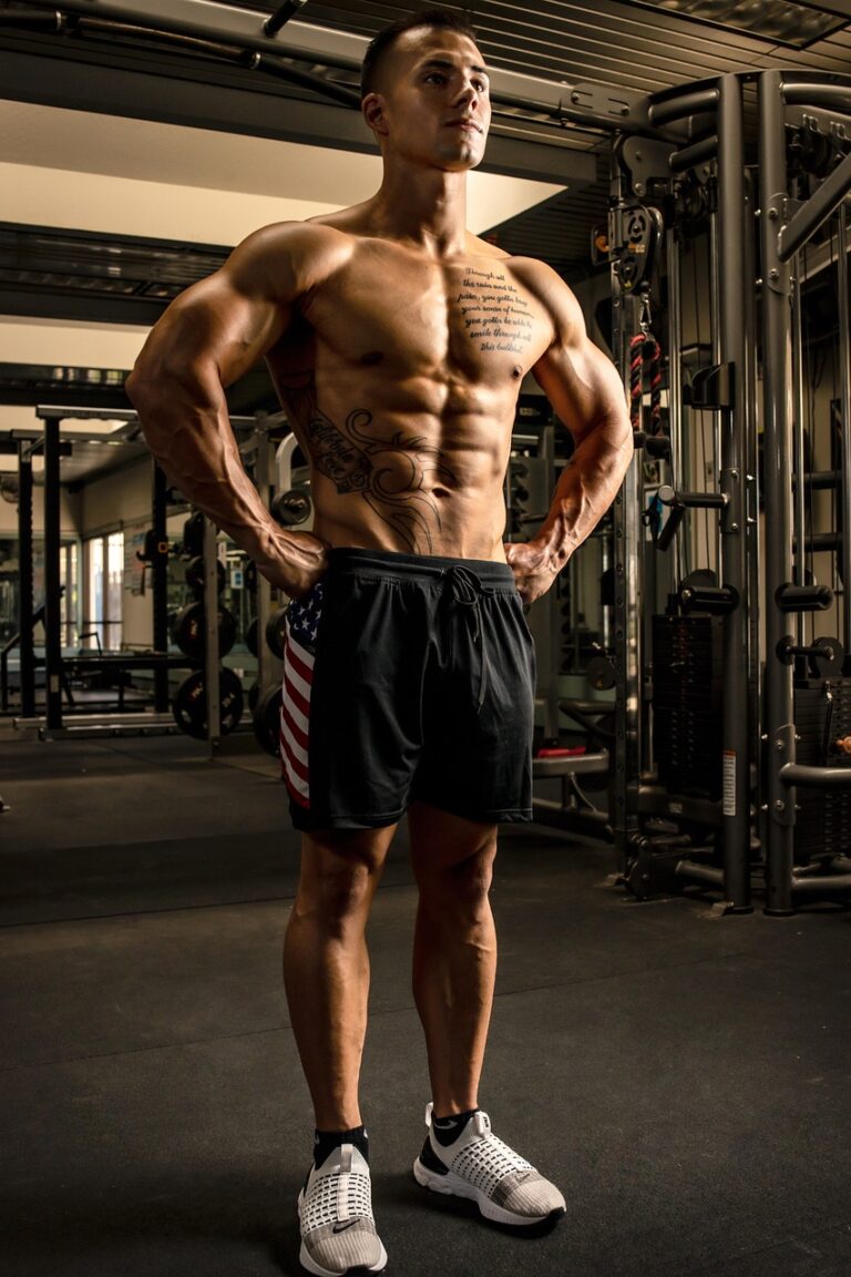 A man lifting a loaded barbell in a gym