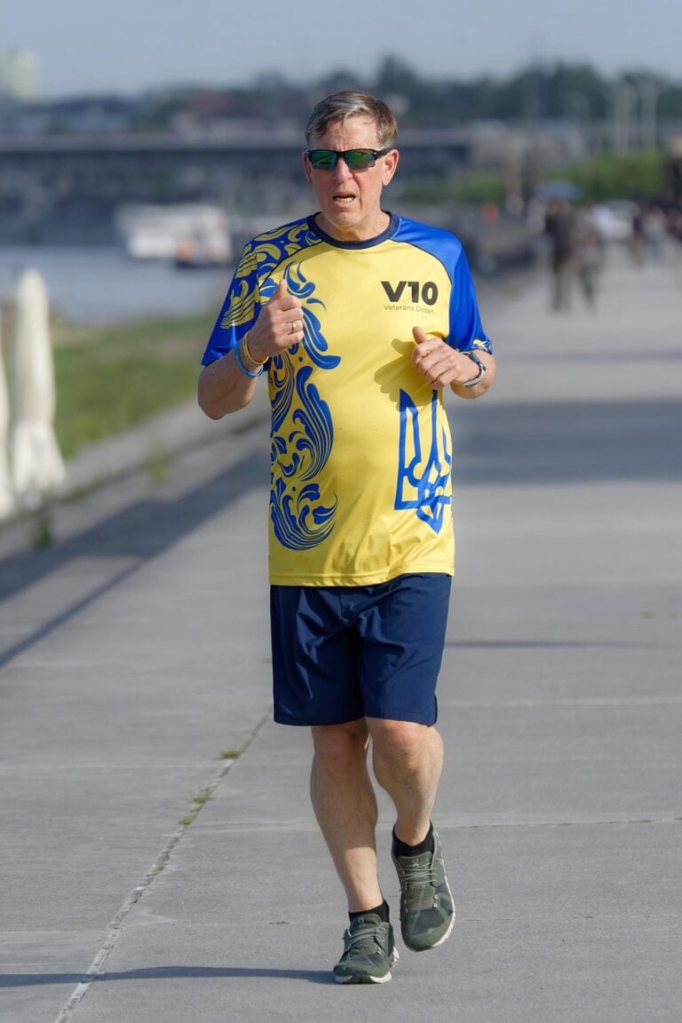 A runner on empty road before sunrise