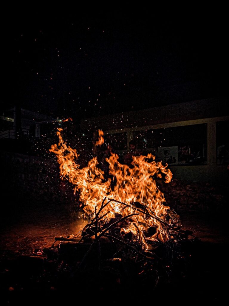 Embers glowing in a night camp
