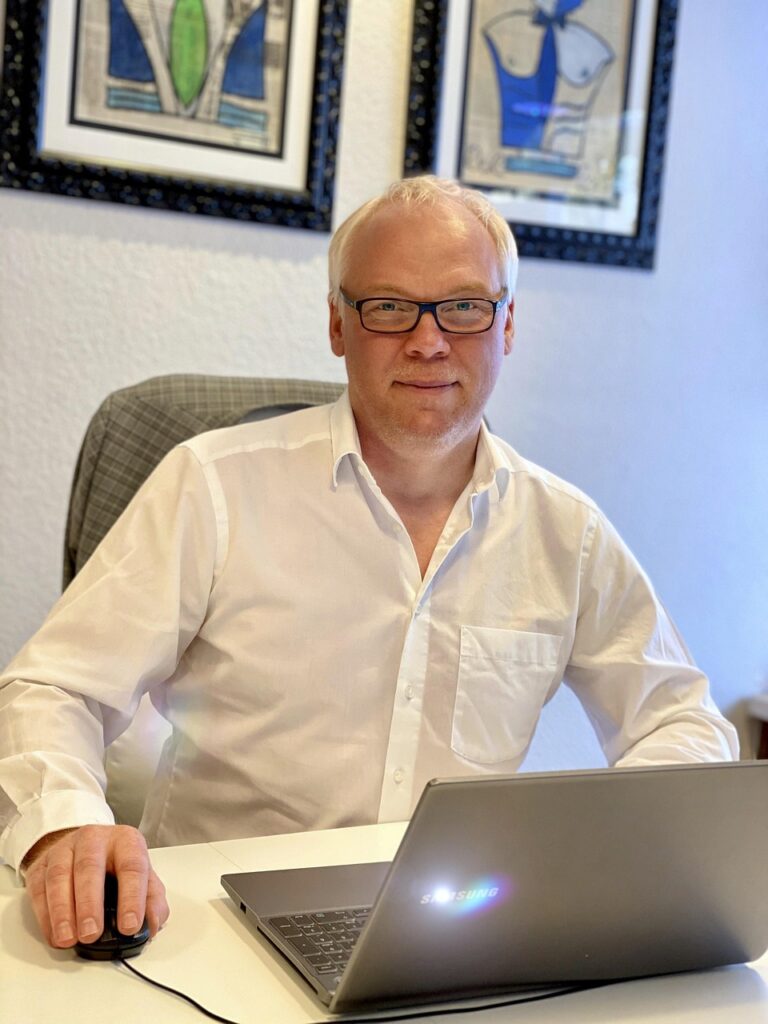 A man working alone at a desk