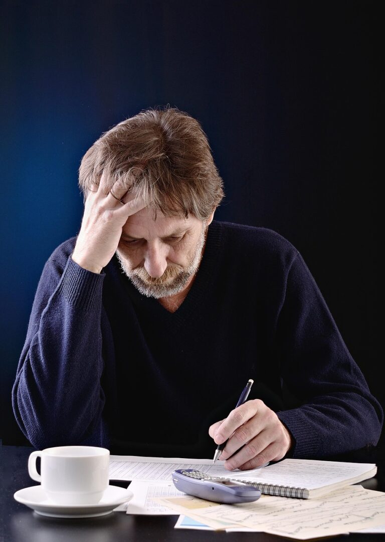 A man working alone at a desk