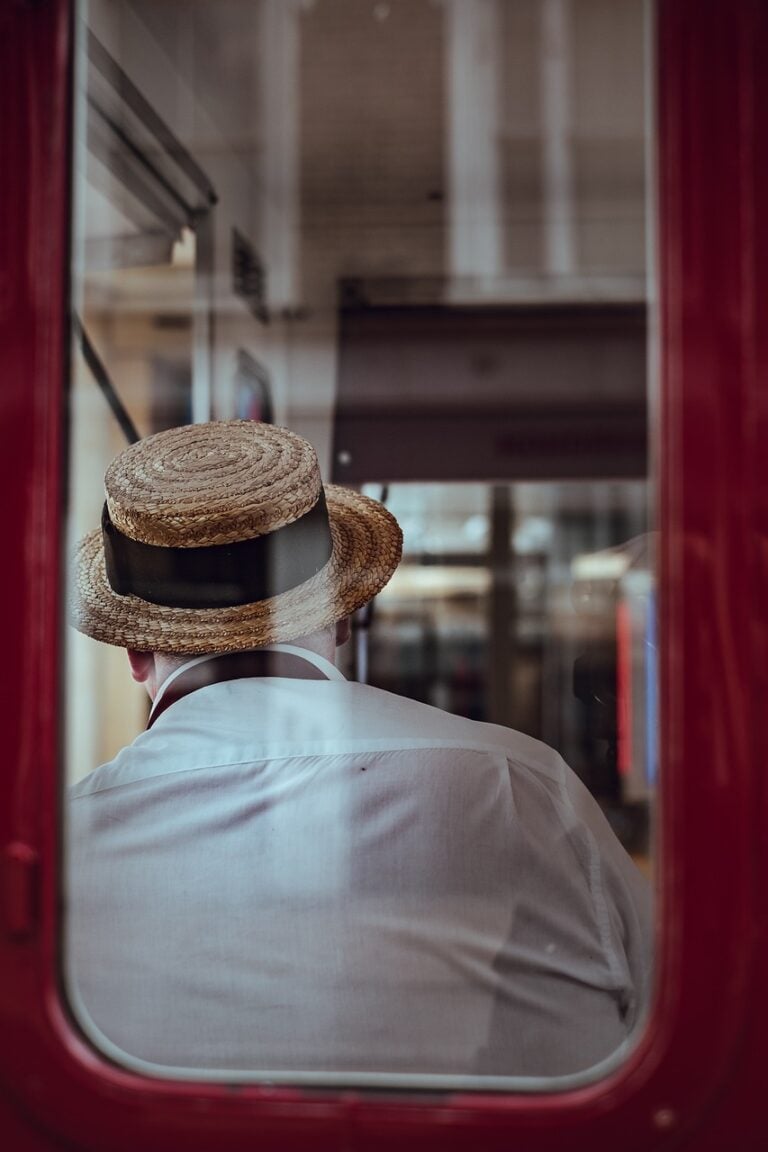 A man standing alone at a window