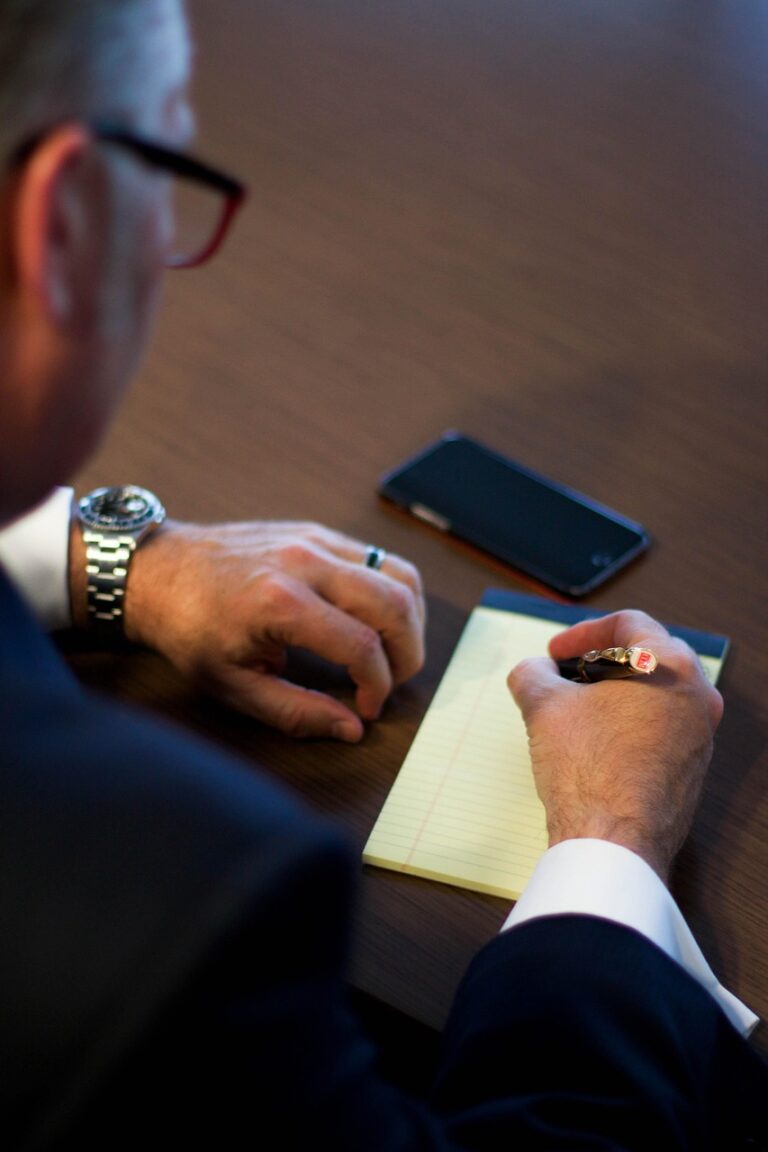 A man concentrating over paperwork