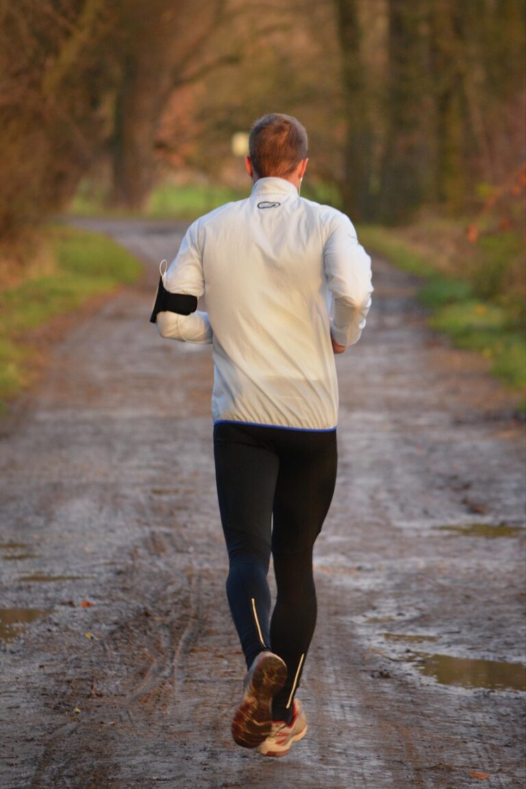 A runner moving through dawn light