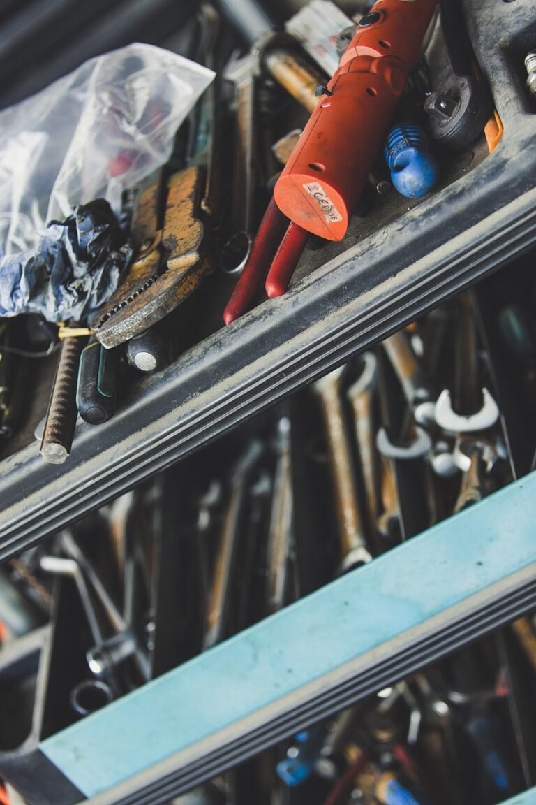 Hands working with tools at a workbench
