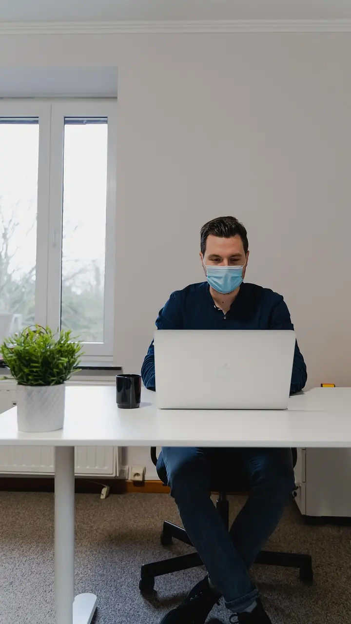 A man concentrating over paperwork
