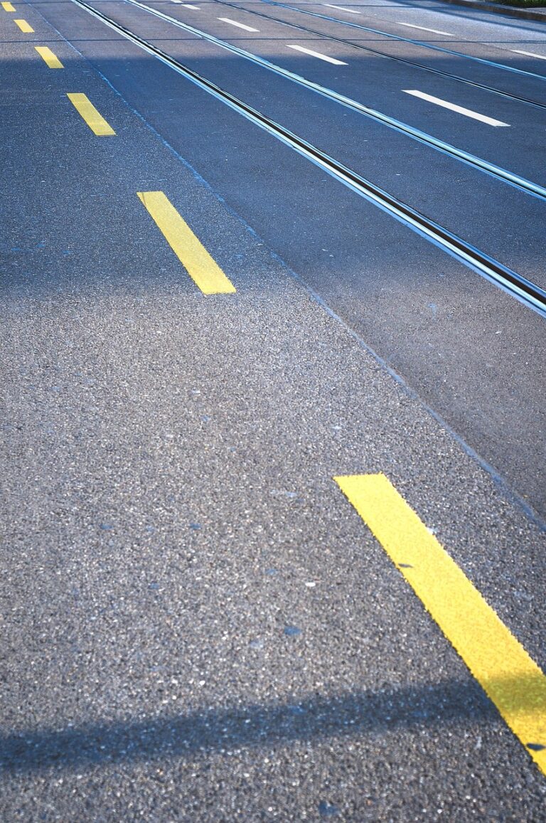 A straight road under open sky