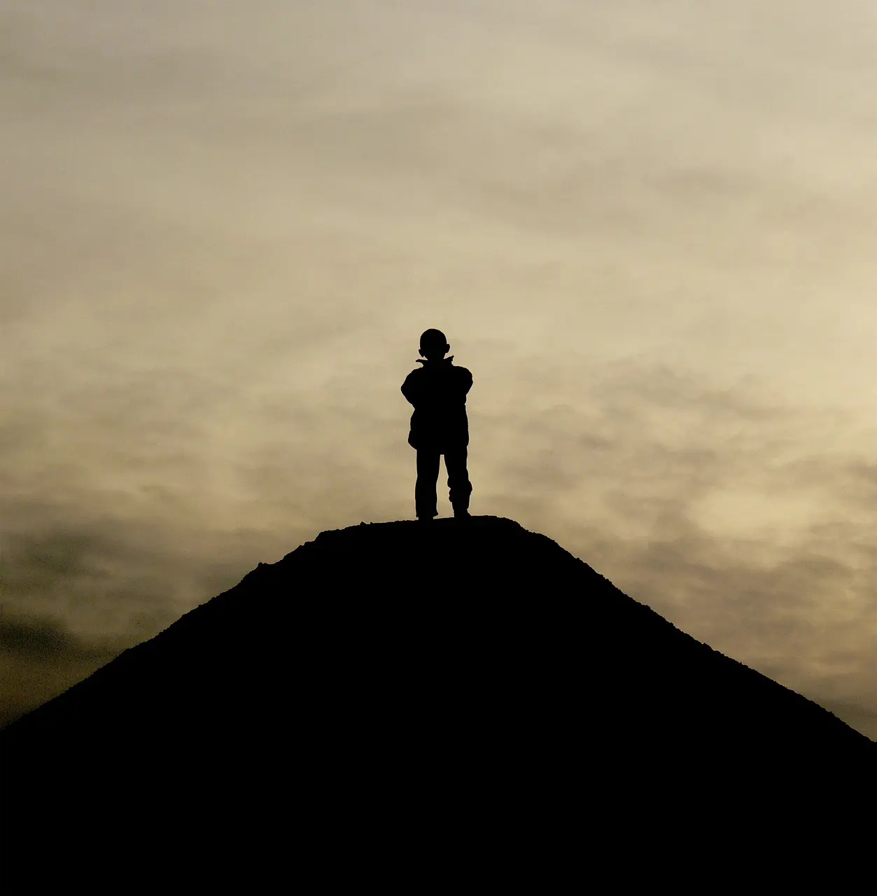 Man alone in shadow, symbolizing the biology of emotional suppression in men