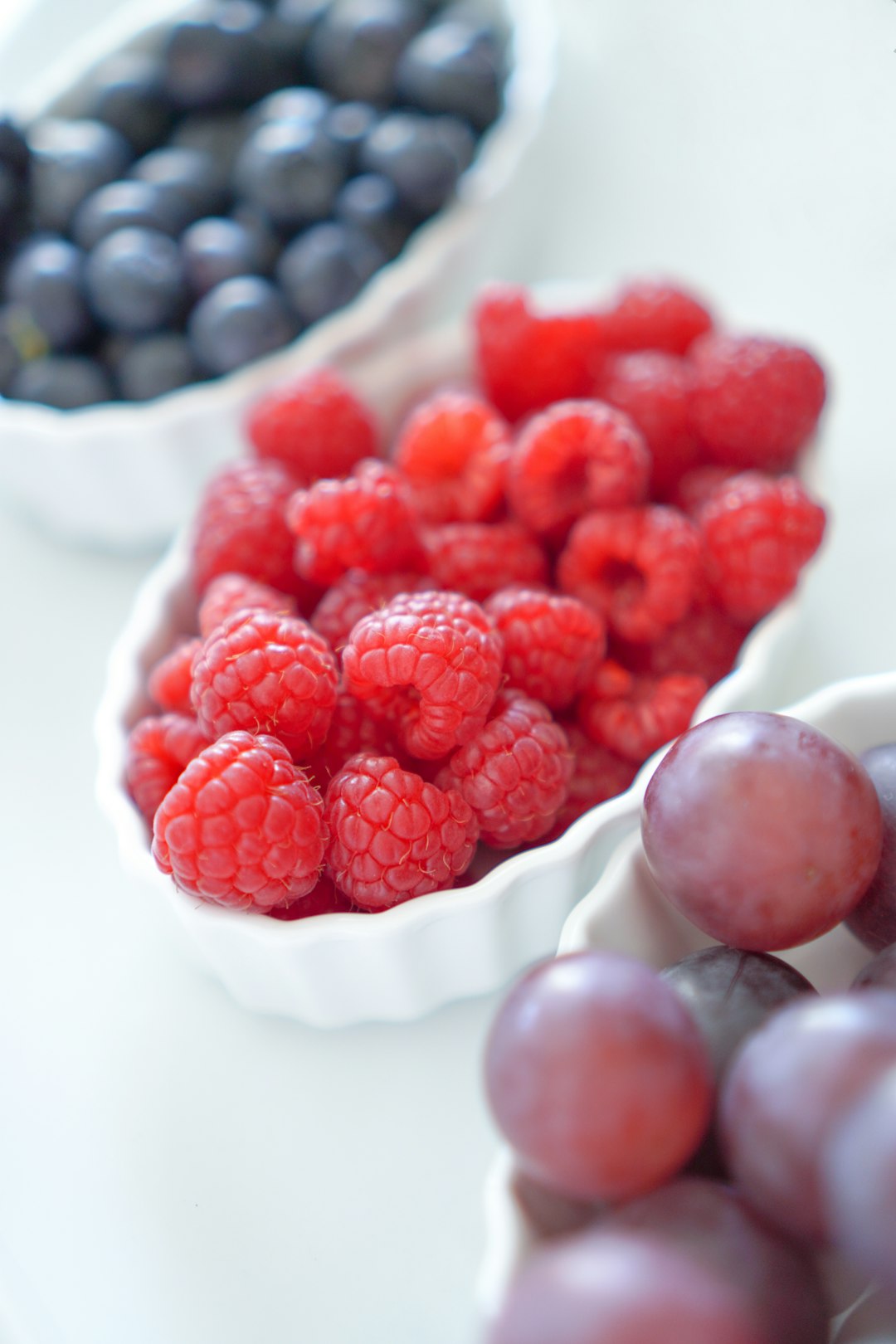 red raspberry on white ceramic plate - Antioxidants in Fighting Inflammation