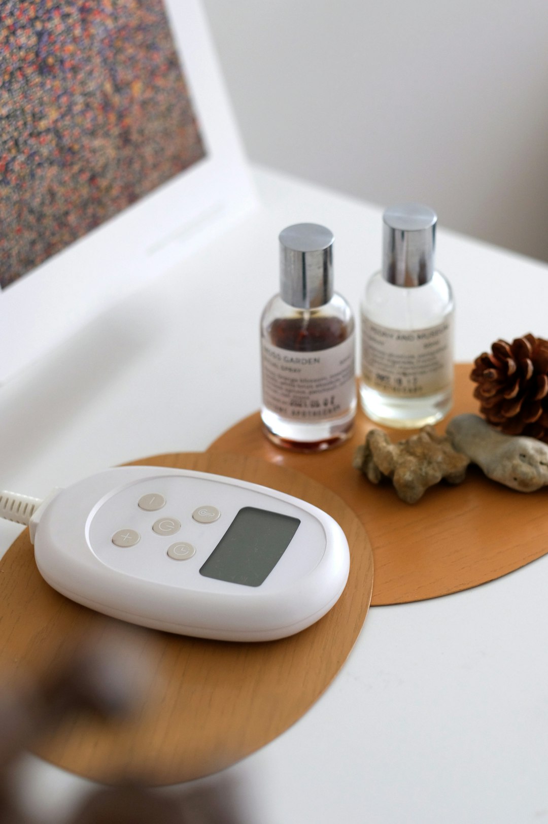 A small scale with a digital thermometer on top of it- Infrared Saunas