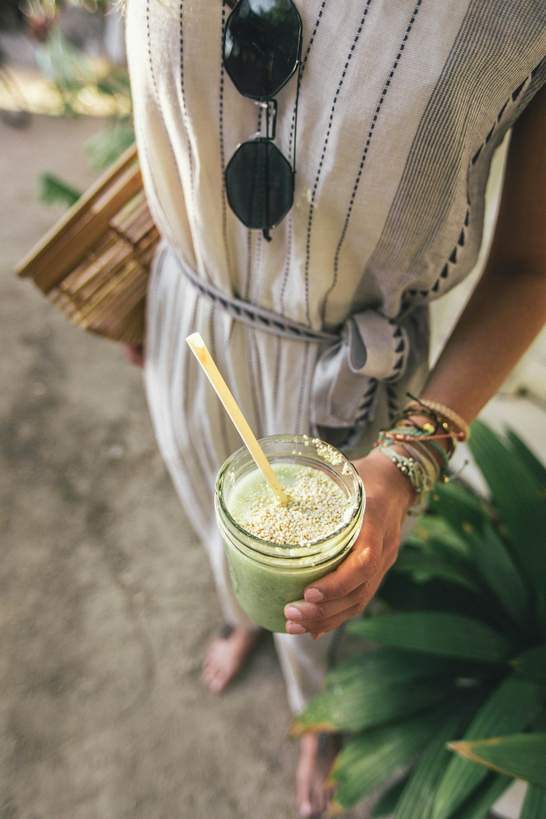 person holding glass cup - Gut Health