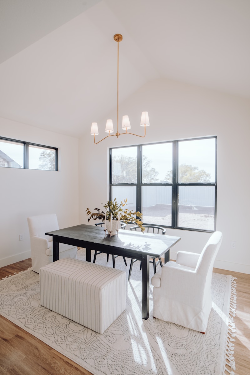 a dining room with a table, chairs, and a bench Recovering from Mold Exposure