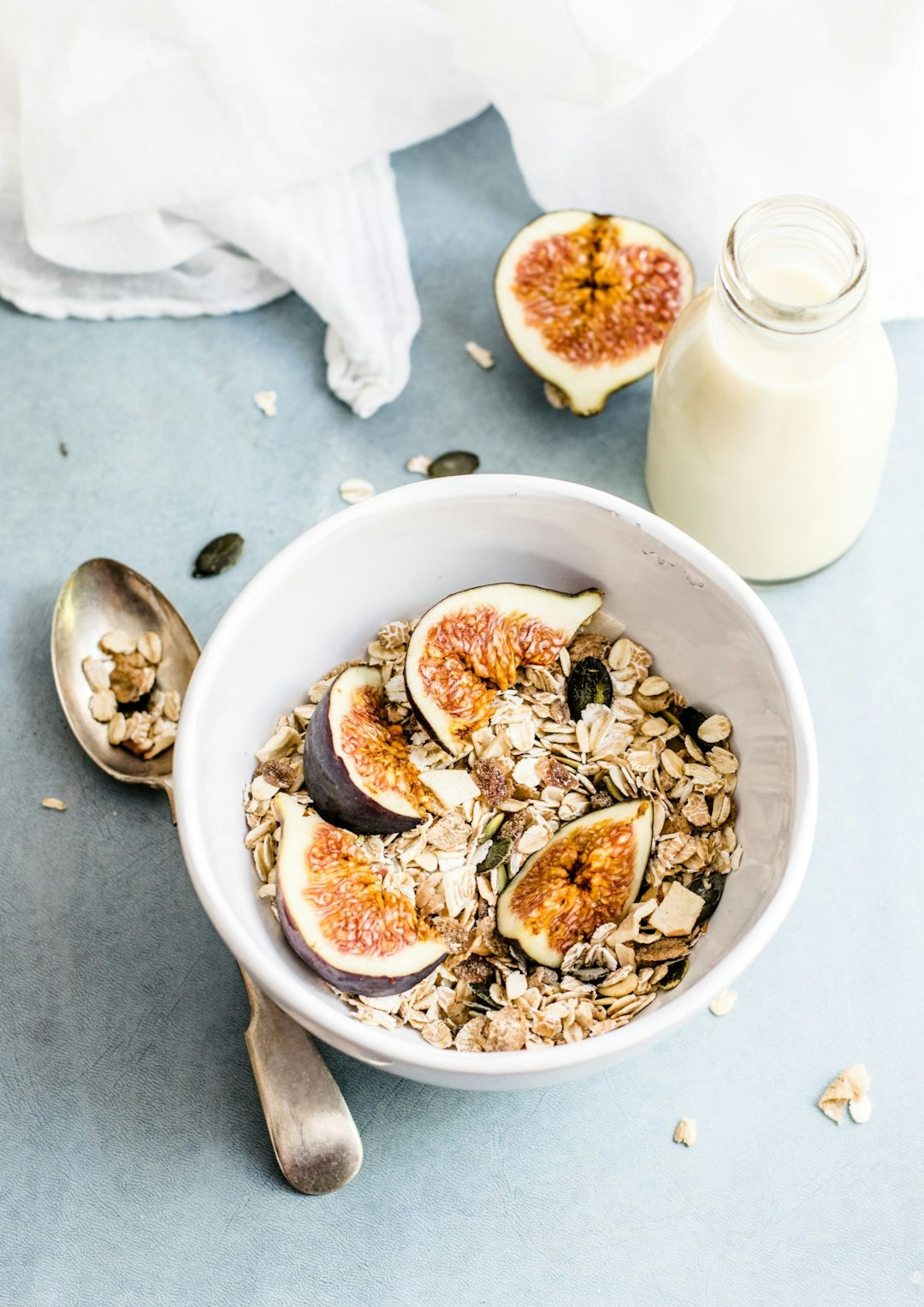 A bowl of oatmeal with figs and a glass of milk - Inflammation and Cognitive Decline