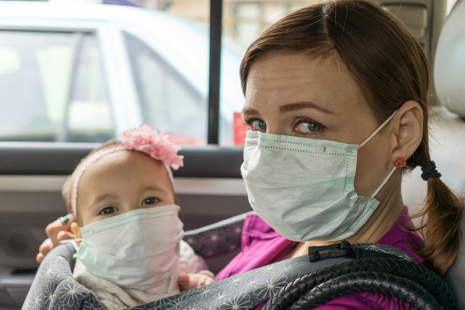 woman and child sitting inside vehicle Systemic Inflammation