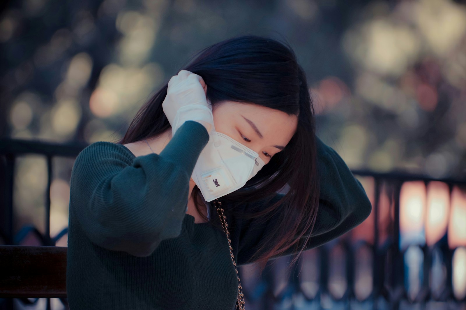 woman in black sweater covering her face with her hands Systemic Inflammation