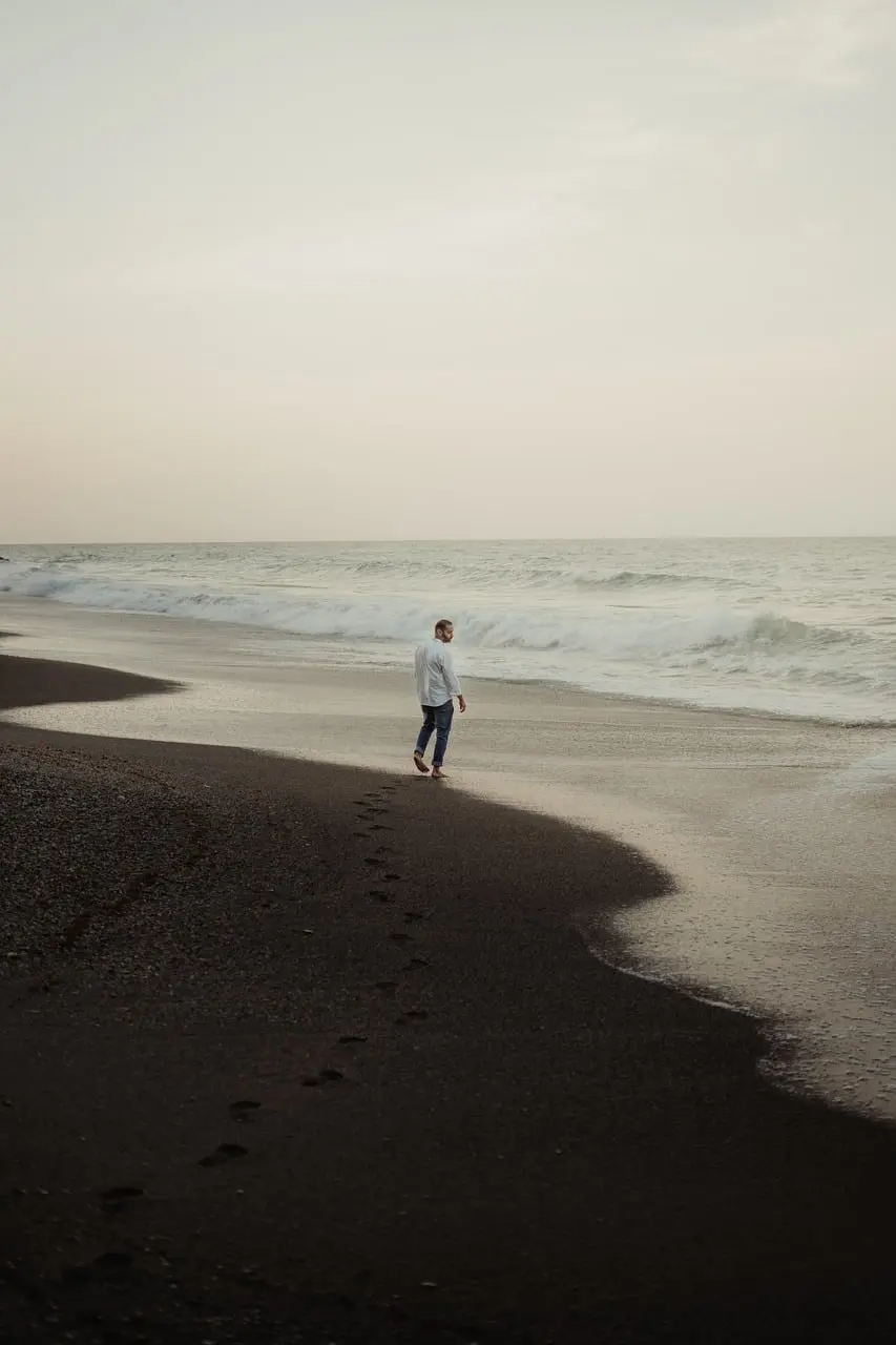 Man silhouetted against a sunrise, symbolizing the search for meaning in suffering