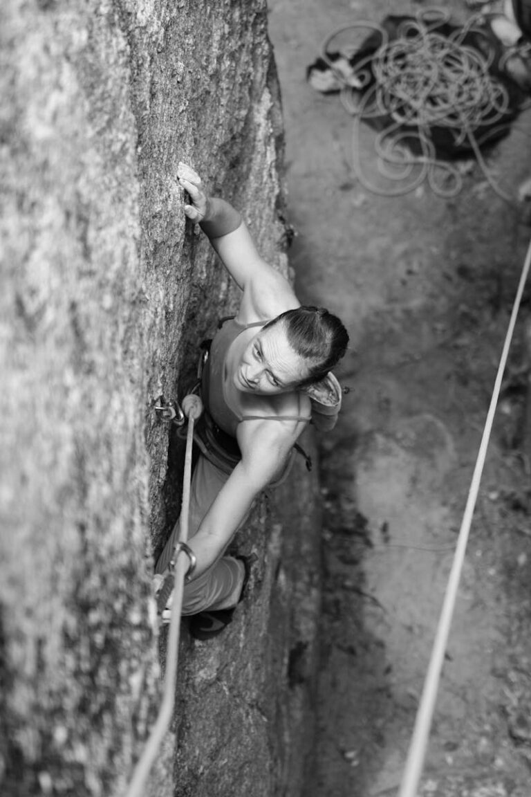 A climber committed to an exposed rock face