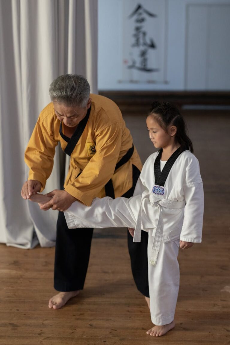 A martial artist mid-technique in a training hall