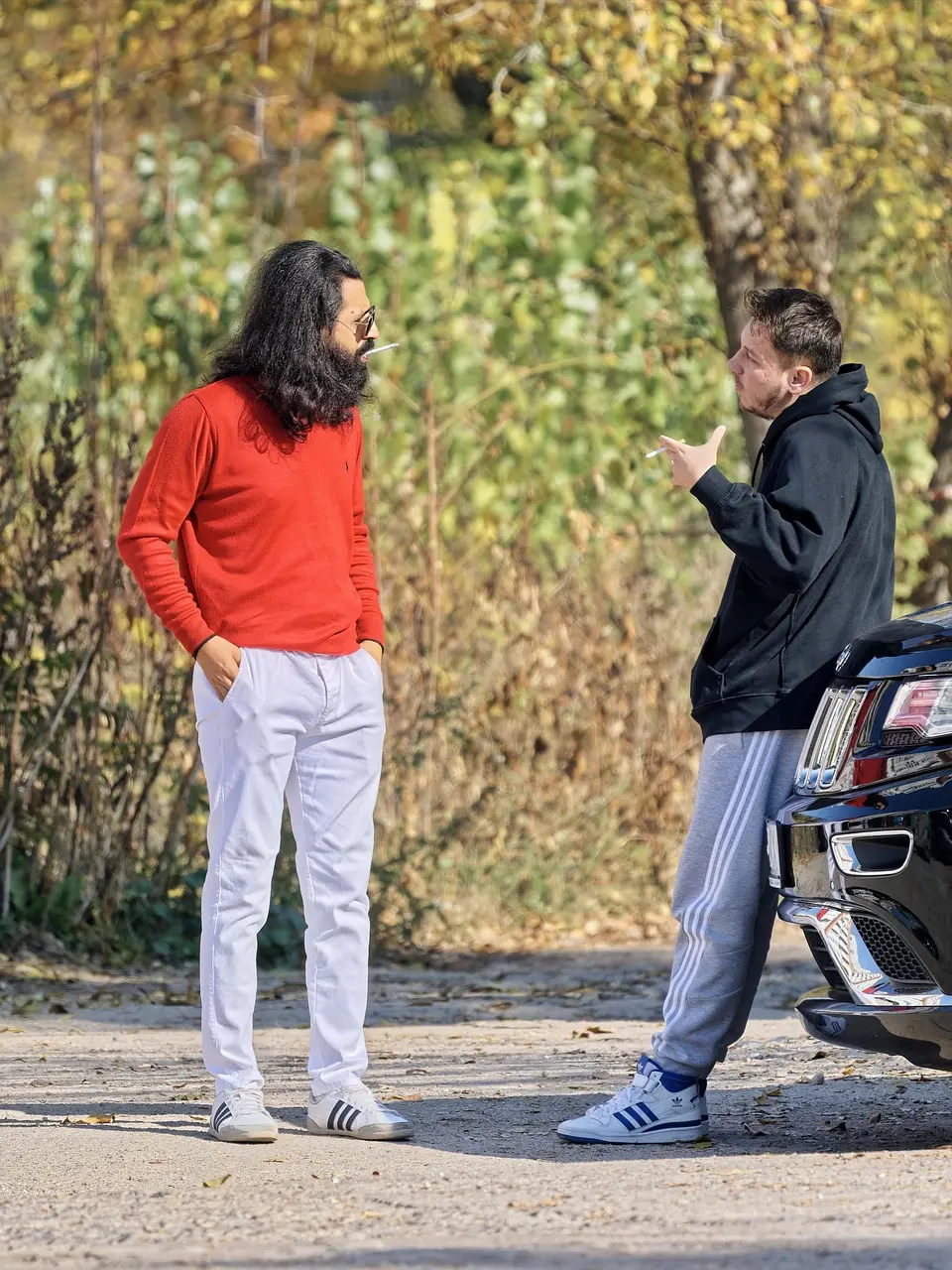 Two men talking outdoors, symbolizing the social-brain architecture behind connection