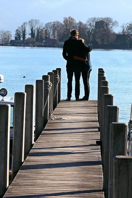 two people supporting each other through adversity and challenge