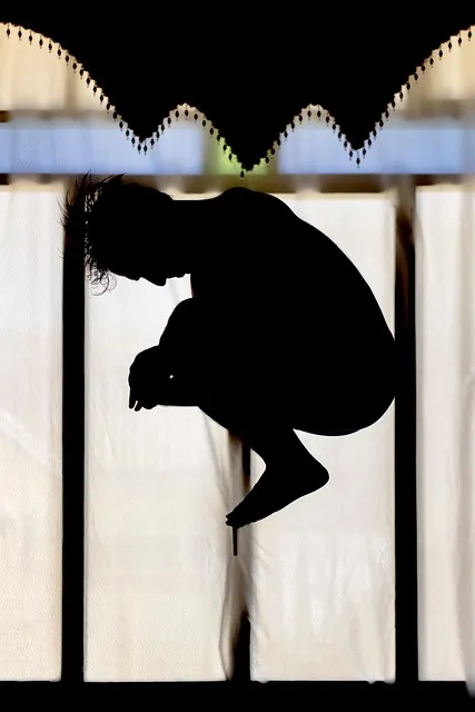 man looking out window at sunset, reflective and still, strategic pause,