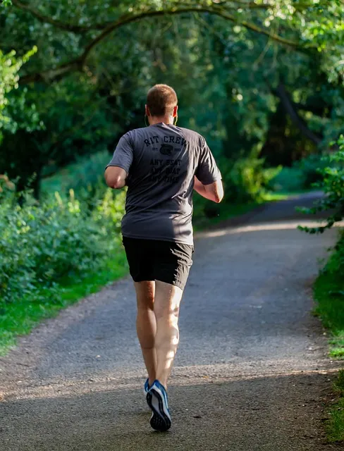 Runner in park representing discipline and accountability in practice