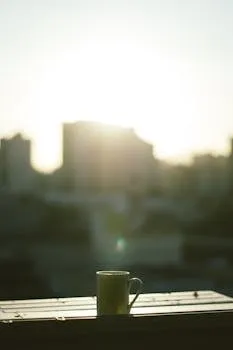 Morning coffee on a balcony at sunrise — the daily ritual that compounds over time