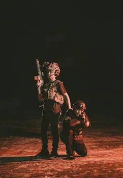 Young individuals in tactical gear stand together, evoking a military