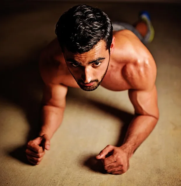 man training with focused discipline through a gym plateau