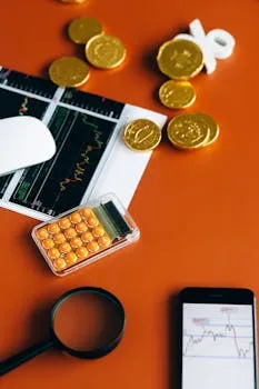 Stock market and financial analysis setup with calculator, graphs, and gold