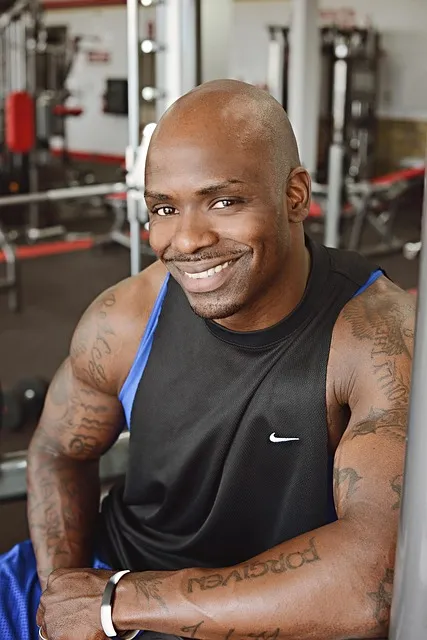 Man training alone in a gym representing dedicated solitary work ethic and