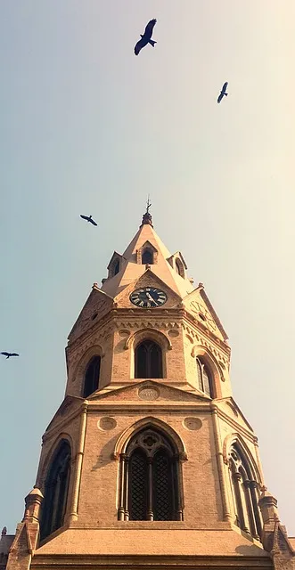 Gothic university clock tower, representing tradition, authority, and