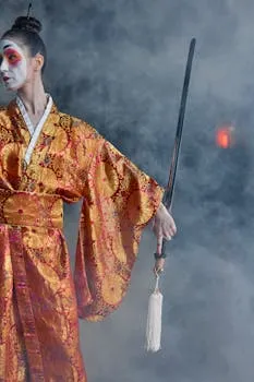 Woman in kimono holding a sword