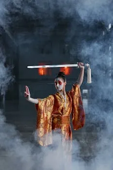 Woman in traditional kimono with sword amid mist