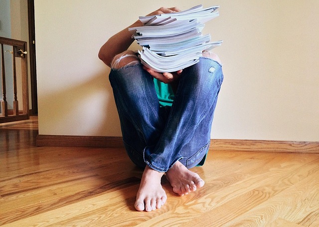 Person reading The Daily Stoic — Your Daily Stoic Summary Questions