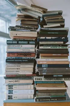Stack of books representing the depth of Antifragile by Nassim Taleb