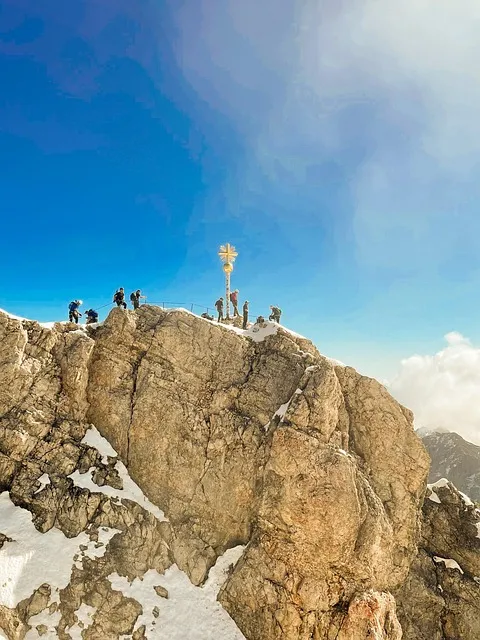 Climber planning next move on mountain face — effort equation in action