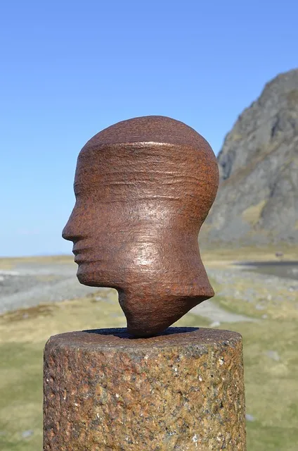 Coastal sculpture head representing philosophical duality two approaches to