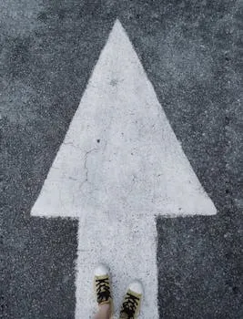 Person stepping forward with decisive attitude and positive momentum