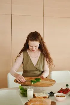 Woman with curly hair preparing a healthy breakfast with vegetables and