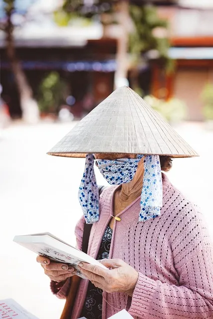 Person reading deeply focused with book in hand