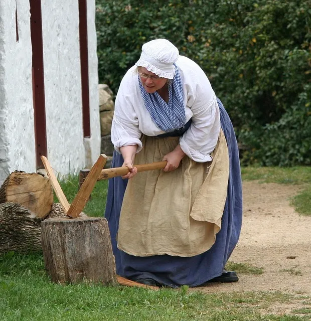 Man chopping wood outdoors representing self-reliance and minimalist discipline