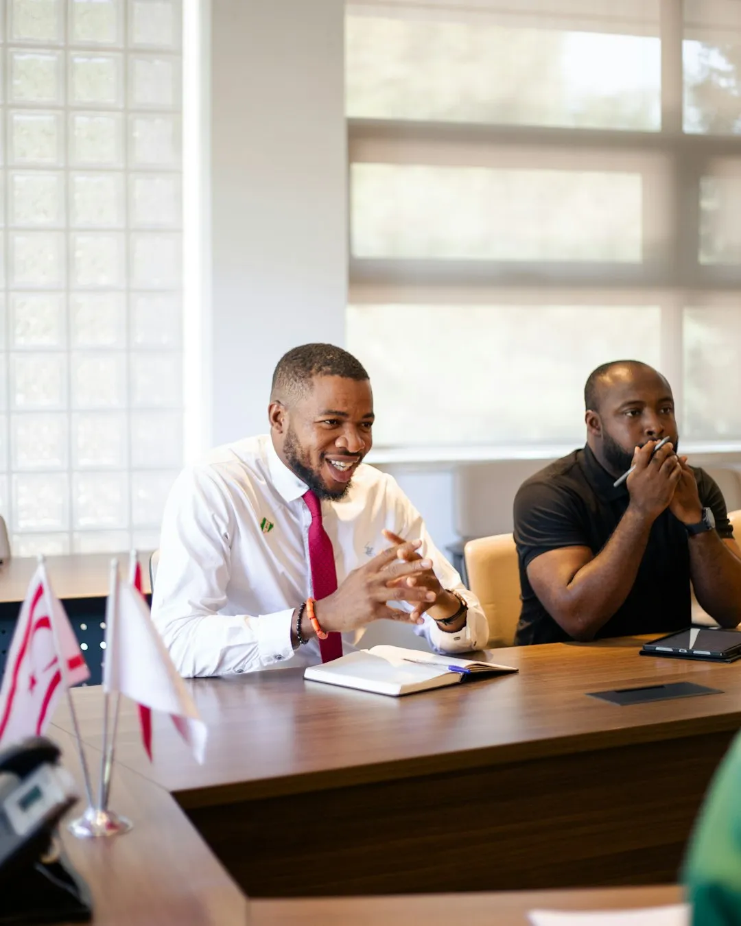 Men in boardroom demonstrating professional integrity and leadership.