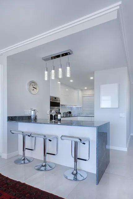 Clean minimalist kitchen with clear countertops showing household items you
