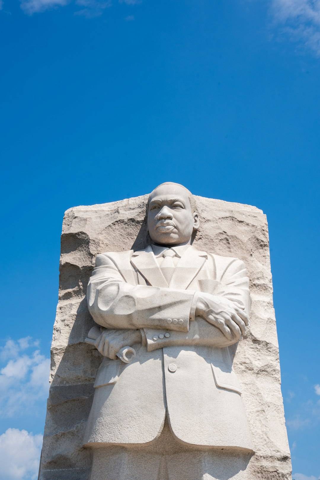 Man standing with arms crossed, holding his ground.