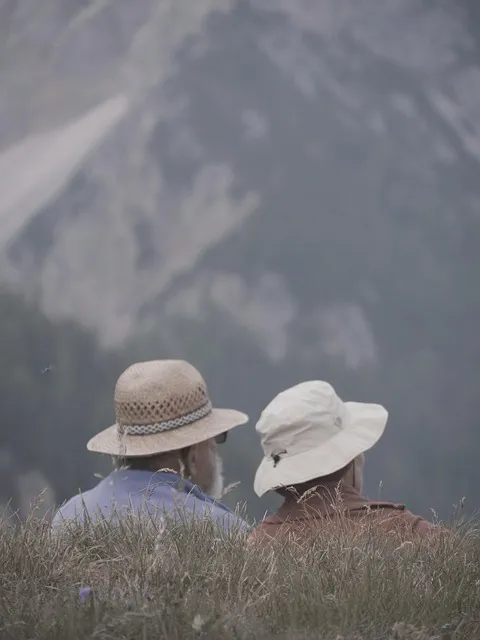 Two hands gripping each other tightly — the struggle that bonds